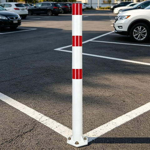 Heavy Duty 32 Inch Stainless Steel Safety Bollards With Bright Reflective Tape Removable Parking Posts For Driveways And Sidewalks Includes Six Concrete Anchors Rock Solid 2 Pack White And Red standing in a parking lot.