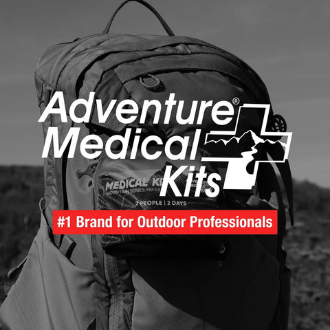 Front view of Adventure Medical Kits Mountain Series Hiker medical kit in sunset color, displayed on a backpack