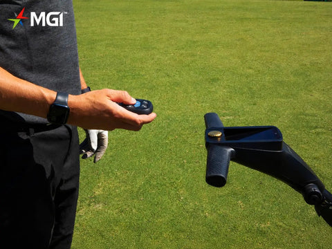 Pro Level Electric Golf Cart With Smart Remote Control And All Terrain Grip For Smooth Walking Assistance and Go The Distance Rounds featuring remote in use.