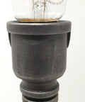 Close-up of steampunk style Pipe Lamp Socket For Half Inch NPT Pipe In Black Finish with Edison bulb base