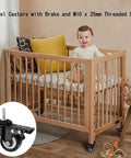 Heavy Duty Swivel Casters 2 5 Inch Set Of 4 With M10x25mm Threaded Stem And Dual Lock Brakes on a wooden crib, showcasing smooth rolling wheels.