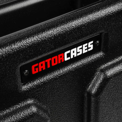 Close-up of GATORCASES branding on Hella Rugged Roto Molded Drum Hardware Case With Retractable Pull Handle And Inline Wheels.