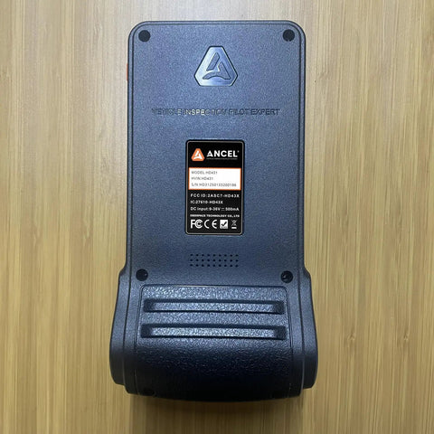 Back view of Heavy Duty Truck Diagnostic Scanner With DPF Regen And Forced Reset For Paccar And Detroit Engines on wood surface.