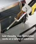 Application of Two-Part Fast Cure Clear Epoxy Adhesive DP100 on an oven door, demonstrating low viscosity self-leveling formula.