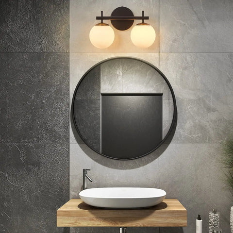 Black And Gold Two Light Vanity Light Fixtures With Globe Milky Frosted Glass for Bathroom Over Mirror, showing mid-century design