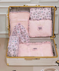 Open suitcase with 6 Piece Travel Packing Cubes Set Waterproof Pink Twill Luggage Organizers for business trips and vacays.