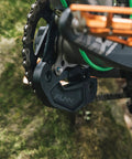 Close-up of a Zippa Lite MTB Bash Guard for ISCG05 Mount Fits 26T To 32T Chainrings on a bike chainring in nature.
