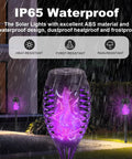 12 Pack Solar Torch Lights With Lit Flickering Flame For Garden Patio And Yard Decor Waterproof Outdoor Lighting Landscape LED Flame Torches For Outside Pathway side view showing IP65 waterproof feature in rain.