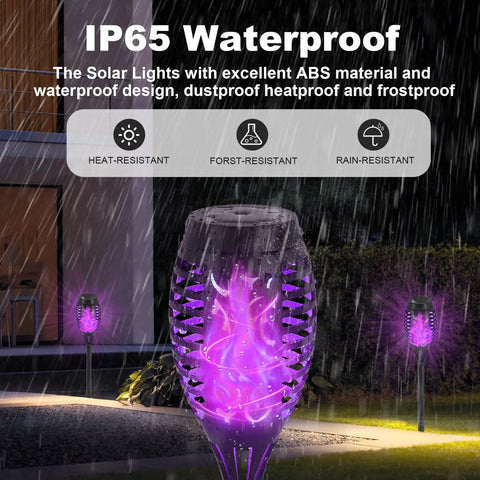 12 Pack Solar Torch Lights With Lit Flickering Flame For Garden Patio And Yard Decor Waterproof Outdoor Lighting Landscape LED Flame Torches For Outside Pathway side view showing IP65 waterproof feature in rain.