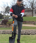 Person holding Heavy Duty Digging Shovel 41 Inch With Trenching Blade And Comfortable Handle For Garden Landscaping Construction And Masonry