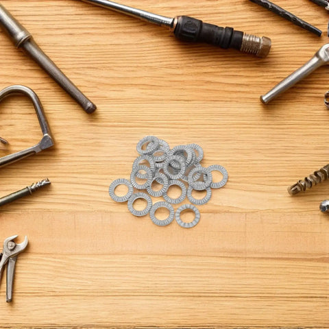 Get Your Garage Ready With These Beefy M10 Manganese Steel Wedge Locking Washers 30 Pairs Set on a wooden work surface with tools.