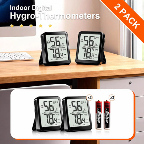 Two Pack Indoor Thermometer And Humidity Monitor With Digital Temp And Humidity Gauge, Real Time Readouts, Battery Included, Ideal For Home, Baby Nursery, Reptile Enclosures, And Greenhouses. Two black digital hygrometers on desk with AAA batteries
