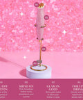 Electric Rhinestone Handheld Milk Frother With Double Coil Whisk And Gold Stand Pink Battery Powered Portable Frother For Lattes Cappuccinos And More Fast Foaming In Under 30 Seconds Requires 2 AA Batteries Not Included on pink backdrop.