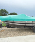 8x28 Foot Waterproof Shade Cloth With Grommets Sun Shade Sail Rectangle Turquoise 260 GSM covering a boat on a trailer