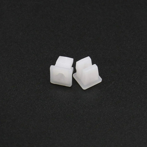 Two white plastic vehicle screw grommets, heavy-duty, fitting 7x7mm holes, for secure installation in car, truck, or boat.