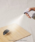 Hella Durable All Surface Clear Topcoat Spray applied on wood to protect and seal against rust and weather damage.