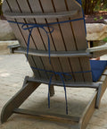 Back view of Outdoor Foam Adirondack Cushion For Chairs, 21.5 W X 50 L X 2.5 D, attached to chair in Sapphire Blue Leala
