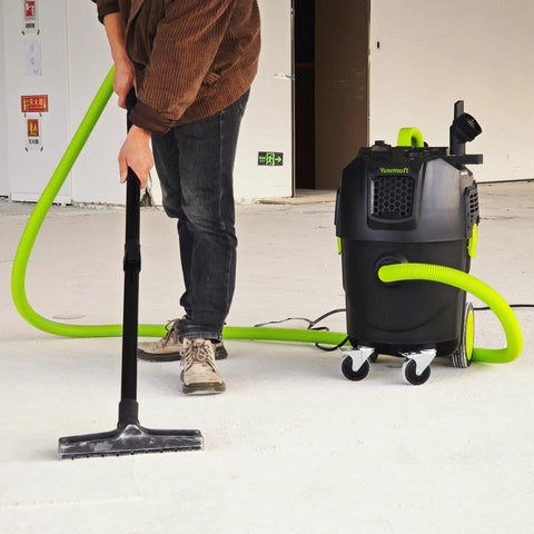 Person using 8 Gallon Dust Extractor With Auto HEPA Clean And Remote Control For Woodworking 150 CFM Airflow on workshop floor
