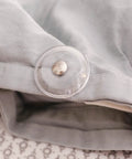 Close-up of a Clear Magnetic Duvet Clips With Magnetic Key For Easy Removal Pack Of 8 Safe Locking Comforter Fasteners on fabric