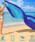 Woman holding Oversized Beach Blanket 78 By 81 Inches Go-To Picnic Mat For 4 To 7 Adults Waterproof And Sandproof