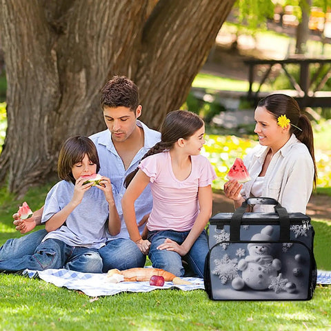 Family enjoying picnic with Go-To Insulated Picnic Backpack Tote With 30L Capacity, snowman stars snowflakes design visible.