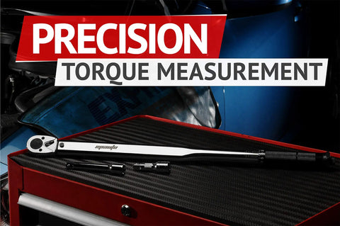 Half Inch Drive Click Torque Wrench 25-250 Ft-Lb Range displayed on workbench with precision measurement backdrop.