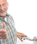 Senior man smiling, holding Heavy Duty 1-1/4 Inch Knurled Bath Grab Bar, ADA Compliant Shower Handrail, wall mount, stainless steel handle.