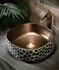 USZWBY Bathroom Vessel Sink 16.9 X 5.9 Inch Bathroom Sink Ceramic Vessel Sink with bronze interior and decorative exterior pattern.
