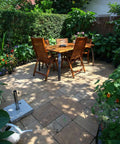 Premium Weatherproof Wood Stain With Semi Gloss Walnut Finish For Indoor And Outdoor Use on a garden patio with wooden table and chairs.