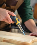 Person using Pro Grade Precision Flame Hand Torch With Adjustable Heat For MAP Pro Propane Fuel on wooden craft project
