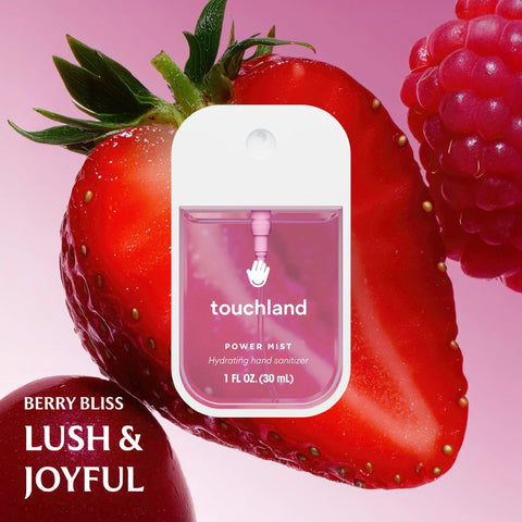 Berry Bliss spray bottle in front of fresh strawberries, part of Hydrating Hand Sanitizer Spray Trio Set With Aloe Vera And Essential Oils