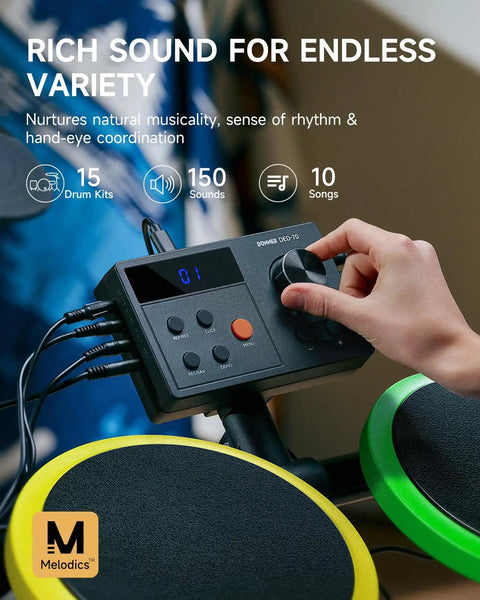Person adjusting control panel on Kids Electric Drum Set 7 Piece With Quiet Silicone Pads And 9 Inch Cymbals, 150 Sounds And 15 Kits.