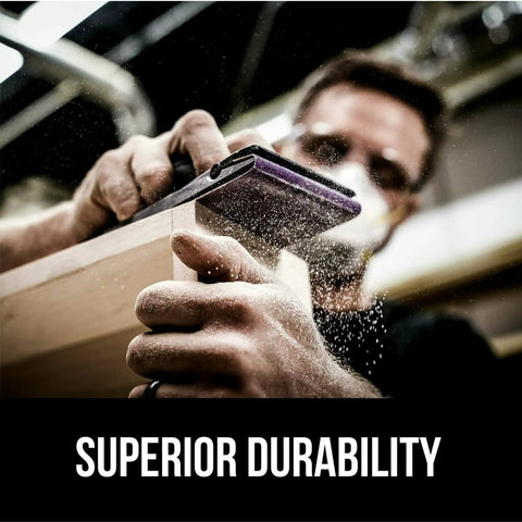 Man sanding wood with Pro Grade No Slip Grip Advanced Sandpaper 9 by 11 inches 220 grit purple clog resistant for smooth finishes