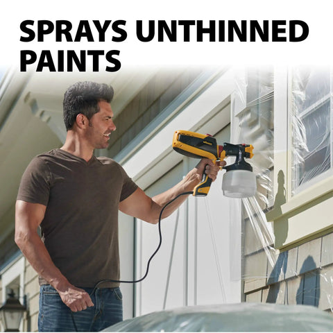 Man using FLEXiO 590 Handheld HVLP Paint Sprayer with Two Nozzles iSpray and Detail Finish on house siding, spraying unthinned paint