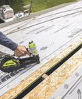 Solid Grip 1 Inch Plastic Cap Staples 2000 Ct Spool being used with pneumatic stapler on housewrap installation.