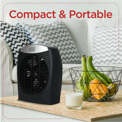 Compact Personal Space Heater With ESave Energy Saving Function on a table with fruit basket, ideal for office or home use.