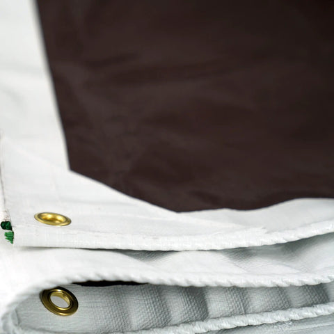 Close-up of Beefy 20 Foot By 30 Foot Waterproof Tarp 16 Mil Thick White And Brown Reversible Tarp showing reinforced corner and grommets