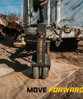 No Sweat Drill Powered Trailer Dolly With 10000 Lbs Capacity and Smart Auto Brake for RV Boat Haulers in use on dirt.