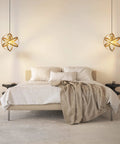 Bedroom setting with two Plug In Pendant Light In Gold Industrial Style Metal Globe With 15 Ft Cord On Off Switch Vintage Vibe Ceiling Fixture.