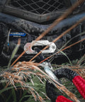 Midnight 4500lb Waterproof Wireless Winch For ATV UTV With 50 Feet Black Synthetic Rope Rugged Off Road Recovery Gear Easy Wireless Control mounted on muddy ATV front
