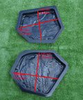 Two hexagonal ABS molds from Six Piece Concrete Molds Set For Flagstone Pavement Stones DIY Kit on grass background