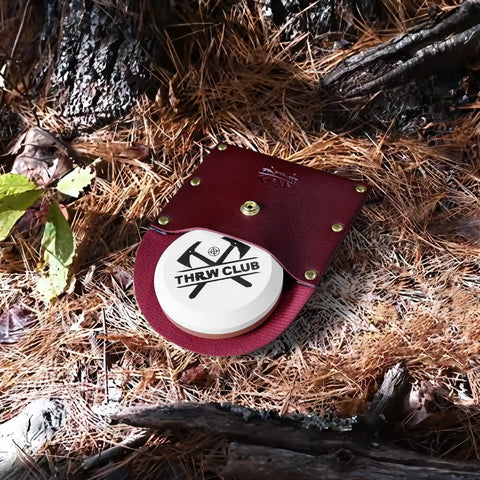 Dual Grit Axe Sharpener Stone 400 1000 with leather sheath in forest setting