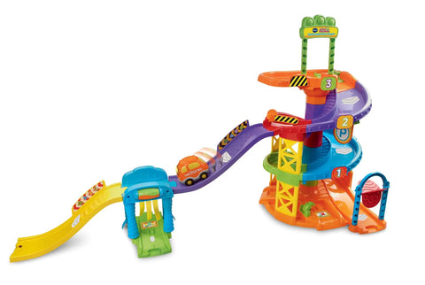 Go Go Smart Wheels Spinning Spiral Tower Playset with Frustration Free Packaging featuring colorful tracks and car wash.