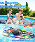 Kids playing with RC Boat With LED Lights For Pools And Lakes, Dual Speed Remote Control Watercraft, Self Righting, Waterproof, Blue