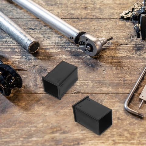 TEHAUX 6-pack black plastic square-tube connector reducer sleeves for 1.57x2.36 in tubing, on a wooden workbench