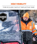 Hi Vis Reflective Winter Bomber Jacket With Zip Out Fleece Liner worn by worker in snow, black bottom, ANSI compliant