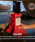 Beefed Up 22 Ton Heavy Duty Jack Stands Pair With Pin Type Height Adjustment under vehicle in garage setting