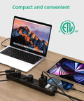Weatherproof Outdoor Power Strip With Six Outlets Six Foot Extension Cord 1875W Surge Protector on desk with laptop and phone