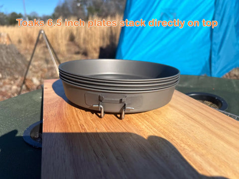 Ultralight Titanium Frying Pan 165mm D6.5 for camping with stacked Toaks plates on wood surface outdoors