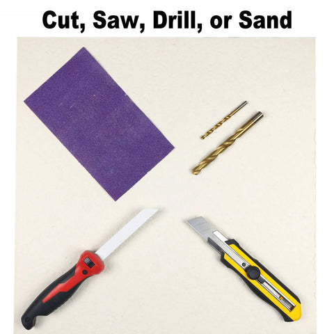 Ceramic fiber board insulation panel, purple, with two drill bits and two utility knives on a light background.